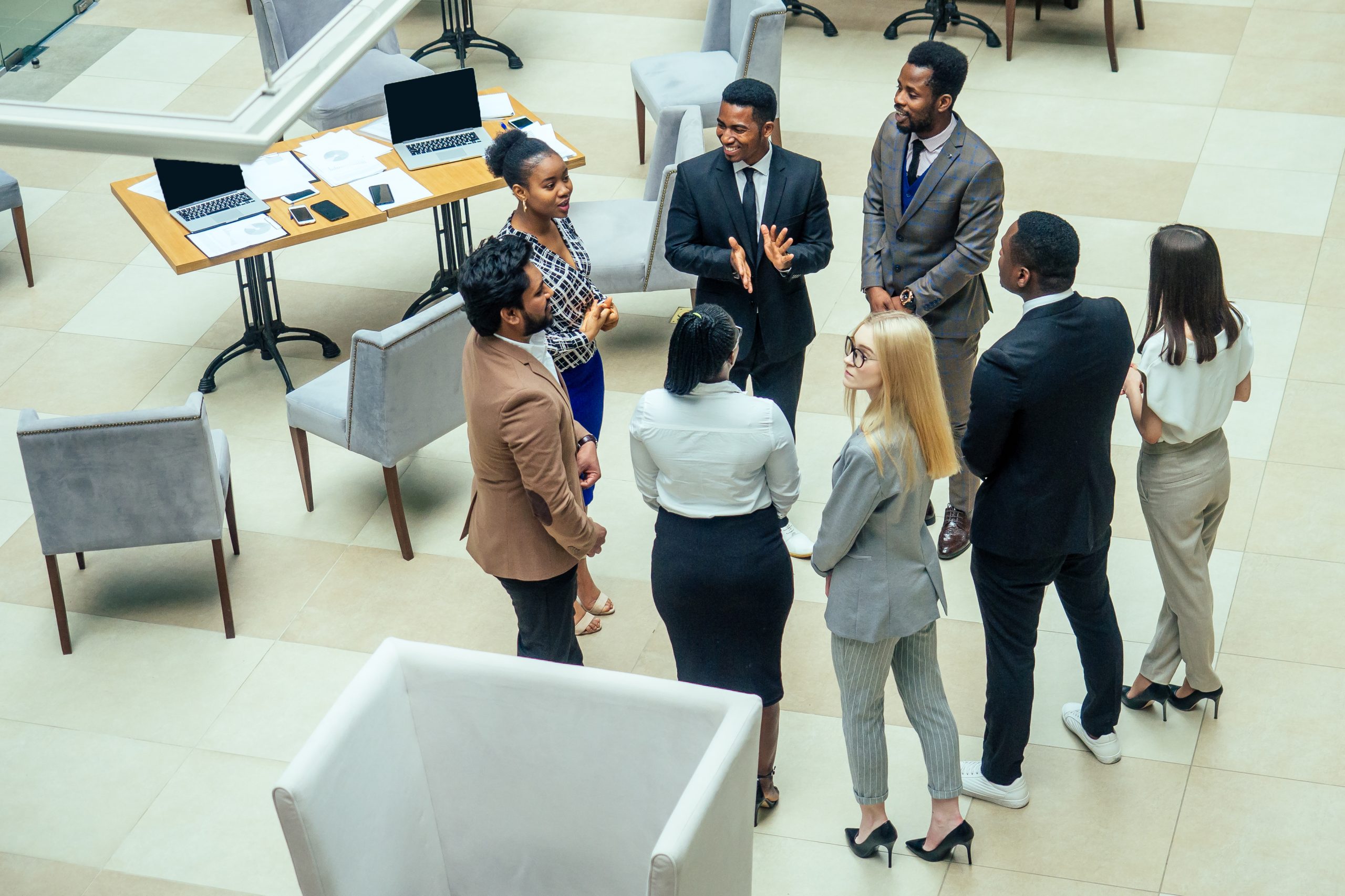 Asian business person in multiracial. Diversity business people form by different races, Indian, Malay, Indonesian, Chinese and African in modern room shopping mall