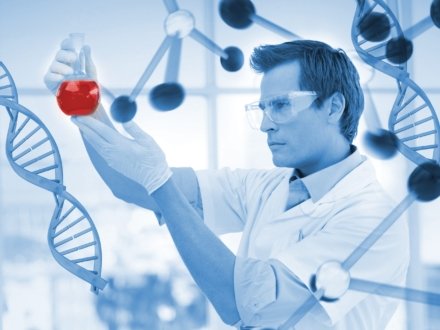 Scientist examining a beaker in a laboratory