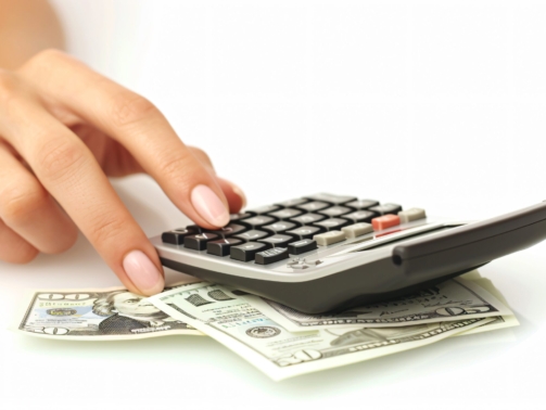 closeup-female-hands-with-bill-calculator