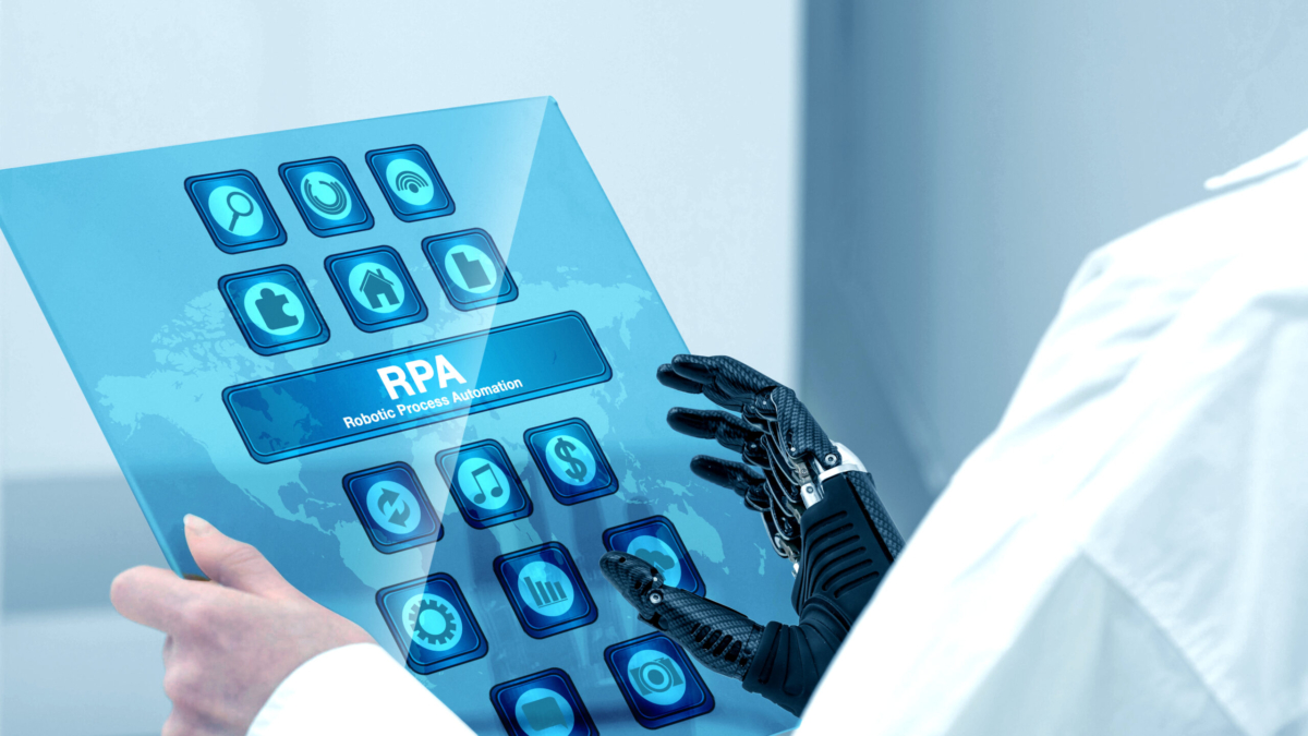 Business user using a low-code platform to create RPA automation with cognitive AI integration in 2025