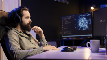 AI becoming sentient and interrupting a programmer who is listening to music at work