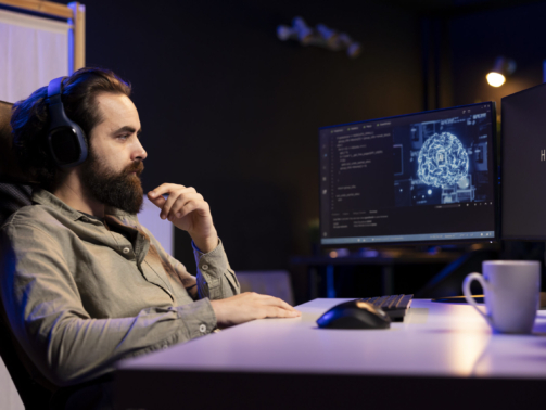 AI becoming sentient and interrupting a programmer who is listening to music at work
