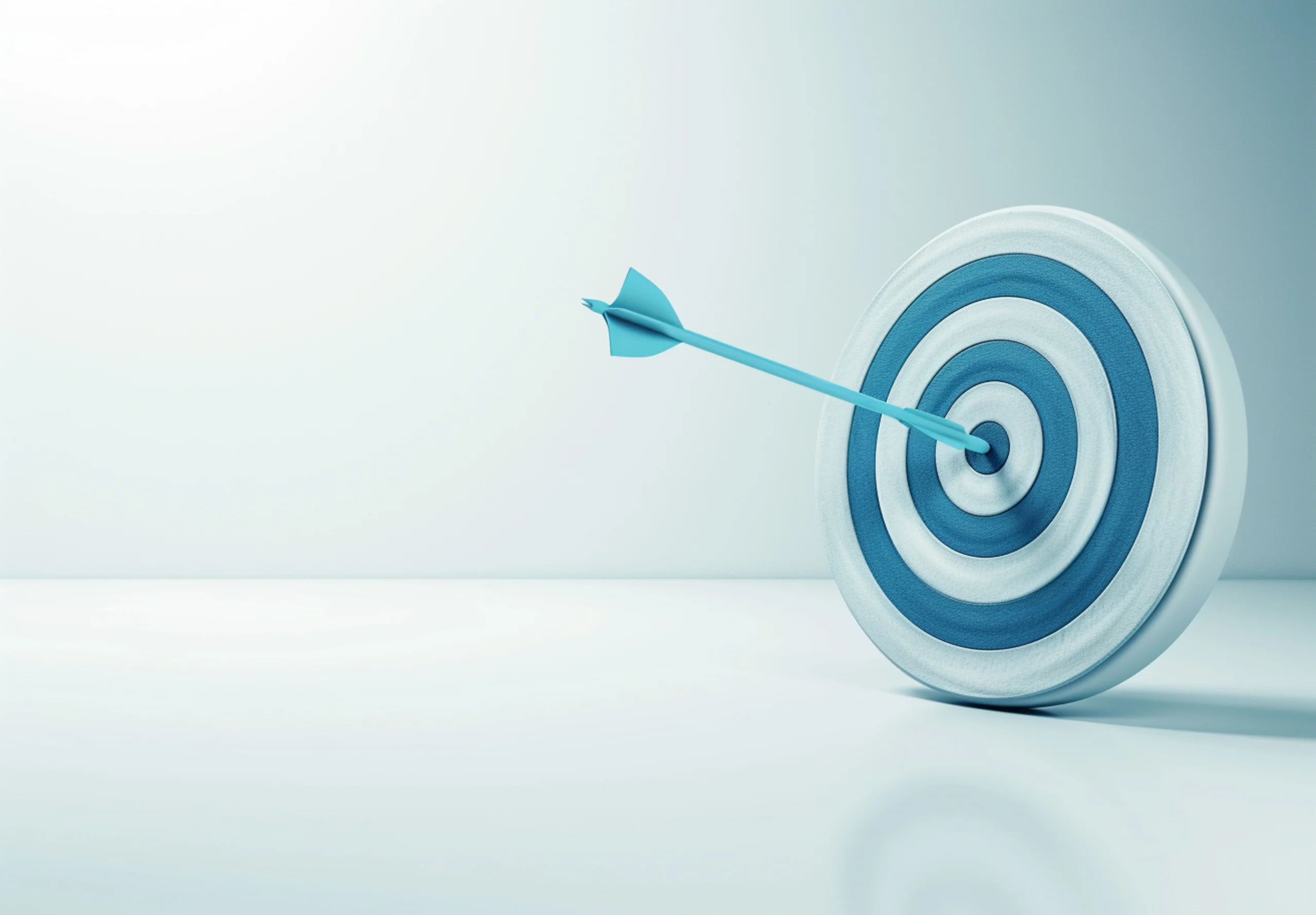 Arrow hitting a target, representing focus on outcomes