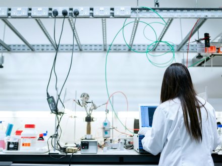 Scientist using a laptop in a laboratory