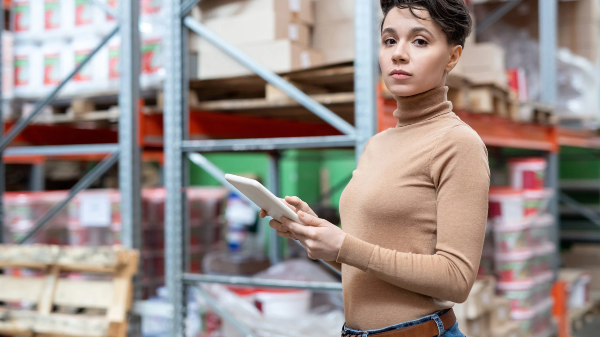 young-female-worker-large-warehouse-using-tablet-scaled-1 (1)