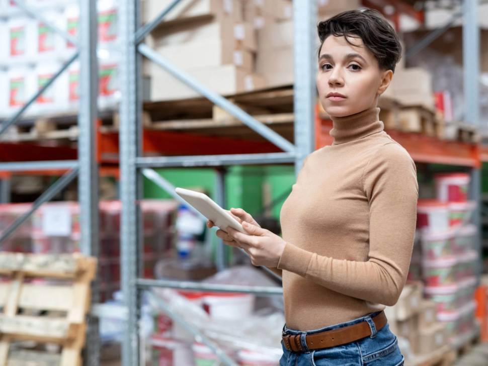 young-female-worker-large-warehouse-using-tablet-scaled-1 (1)