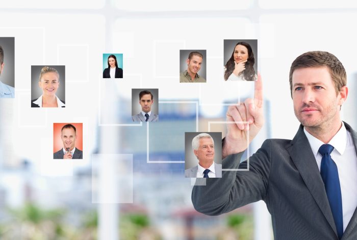 Digital composite of Businessman interacting and choosing a person from group of people interface